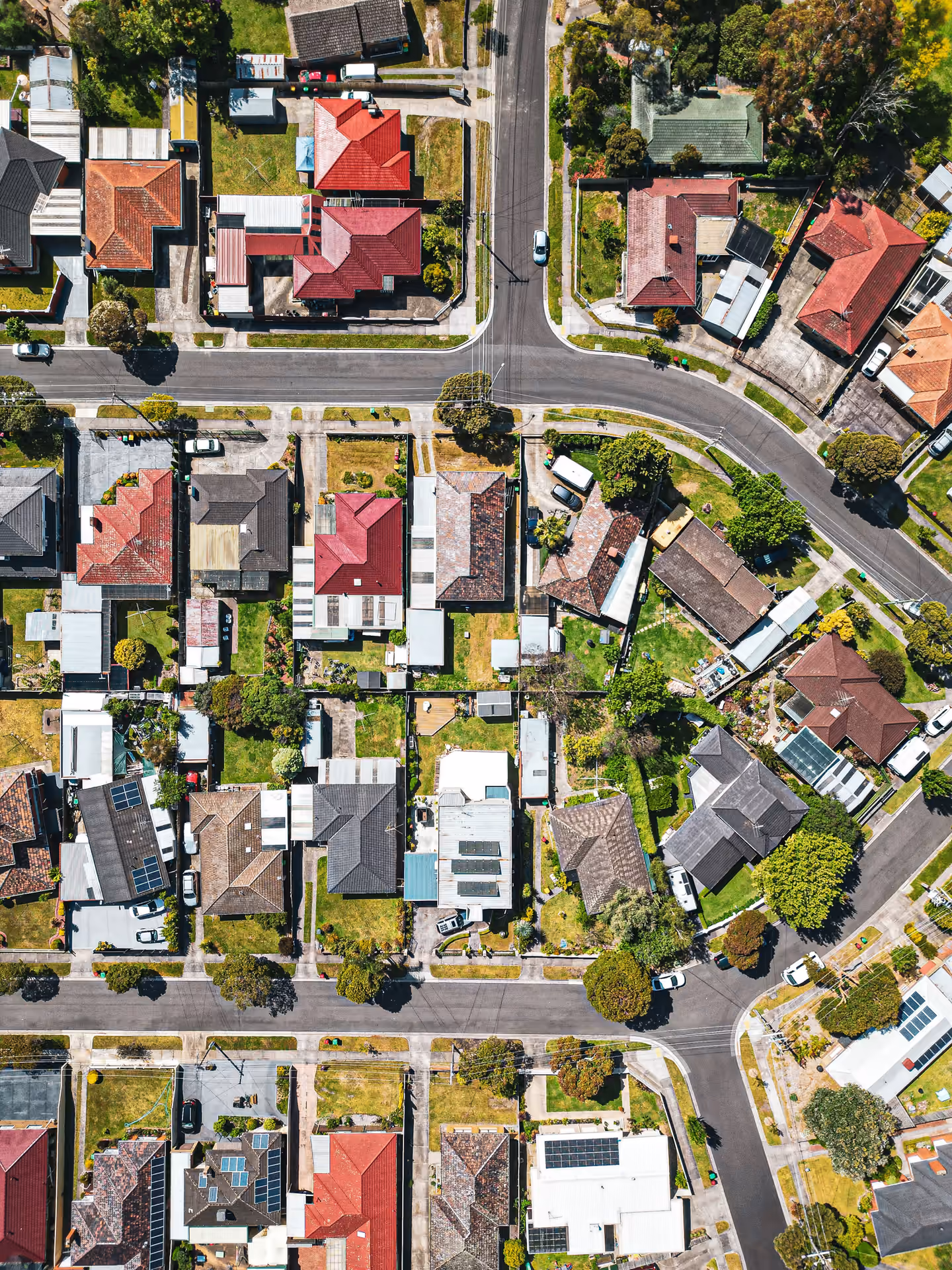 Aerial view of suburban houses and pitched rooftops