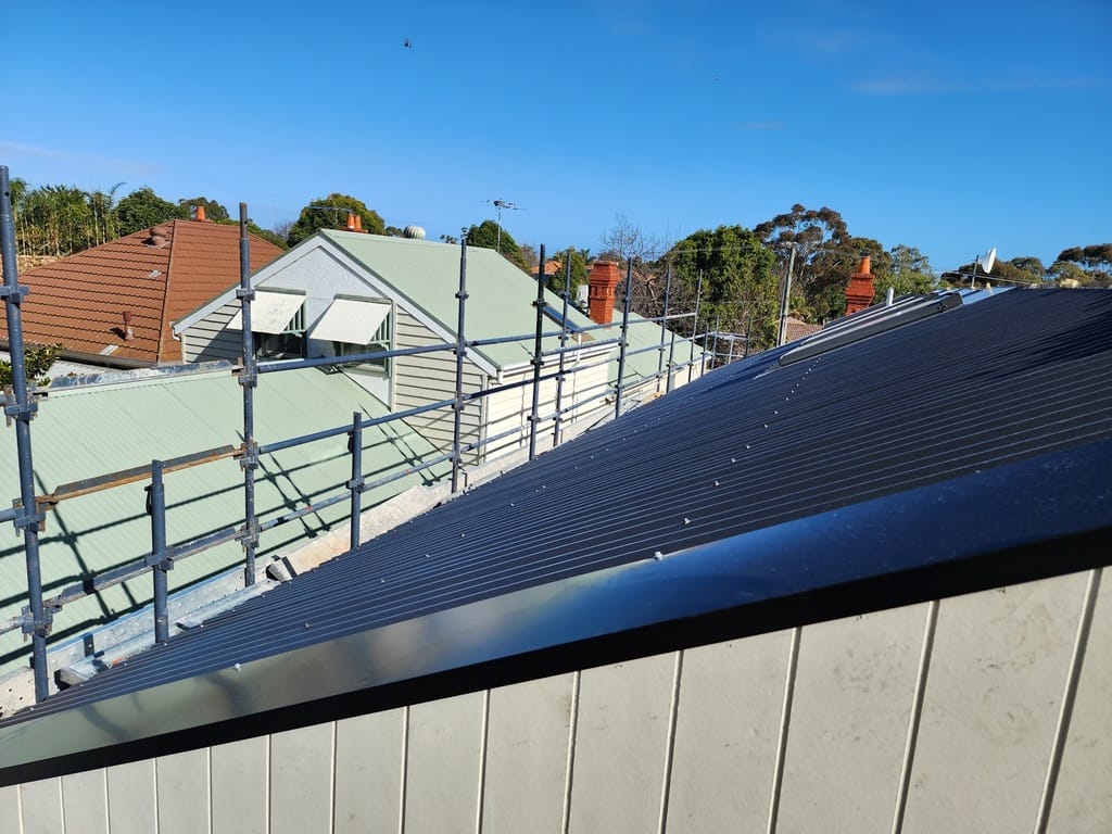 New dark Colorbond corrugated roof with scaffolding still in place